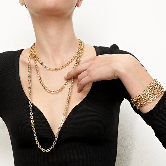 Long necklace with three turns in gilded bronze